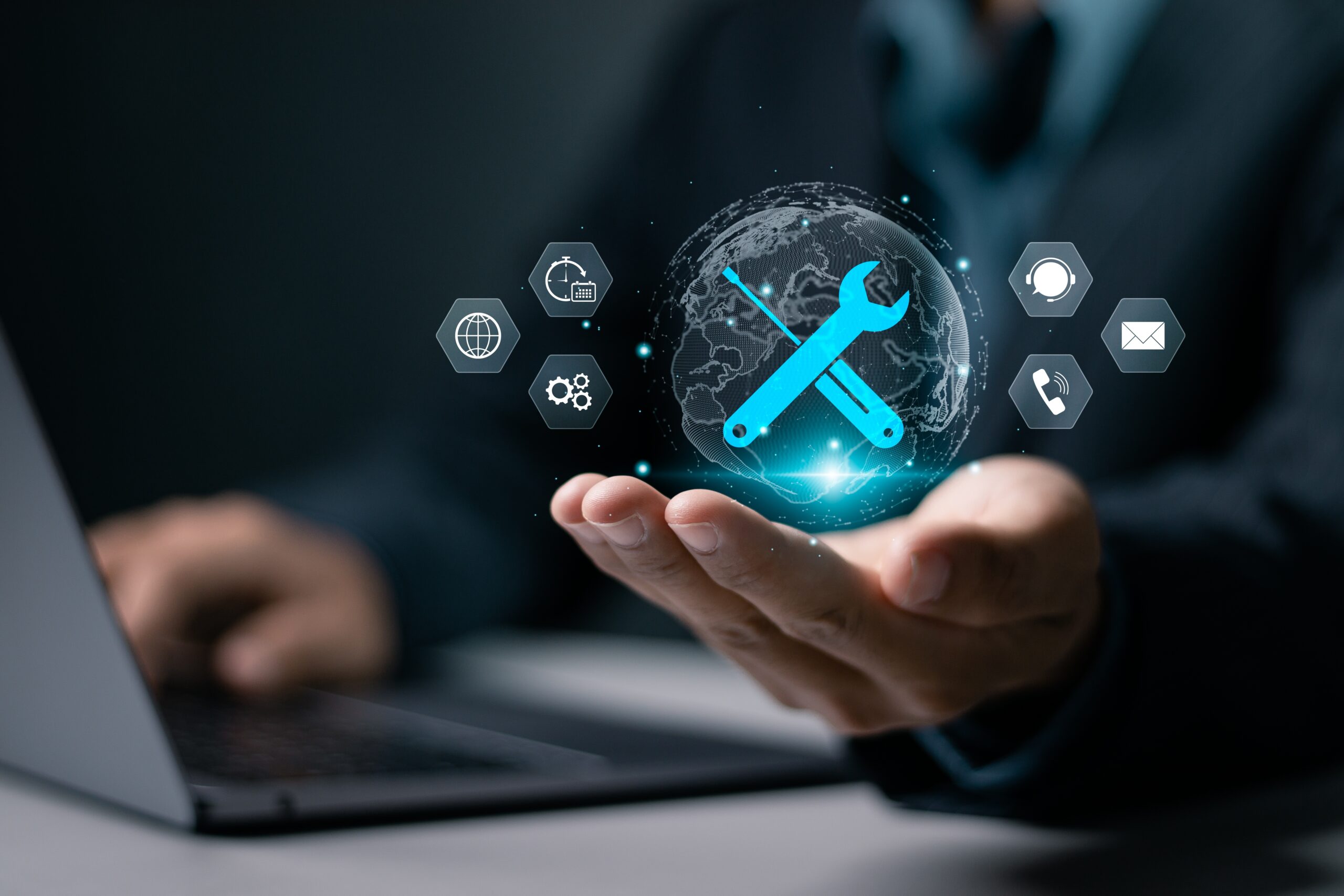 A hand holds a glowing globe with a wrench and screwdriver, symbolizing global digital solutions and tech support, alongside icons for communication and settings.